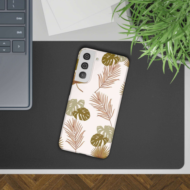 Nature-inspired mobile phone case with tropical leaf design on a desk.