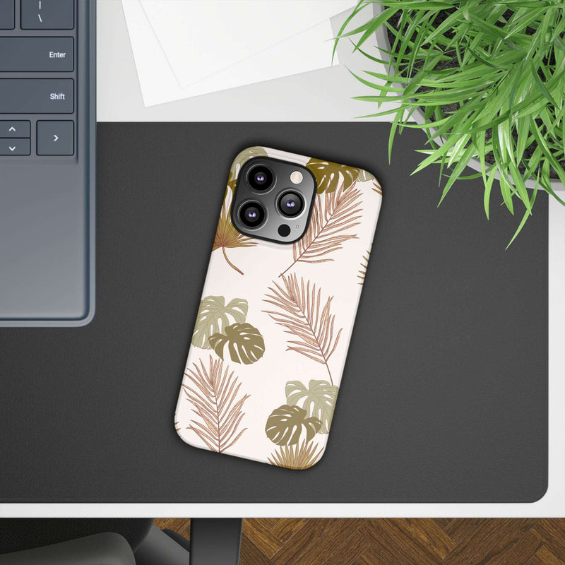 Nature-inspired mobile phone case with tropical leaf design, slim polycarbonate protection, supports wireless charging.