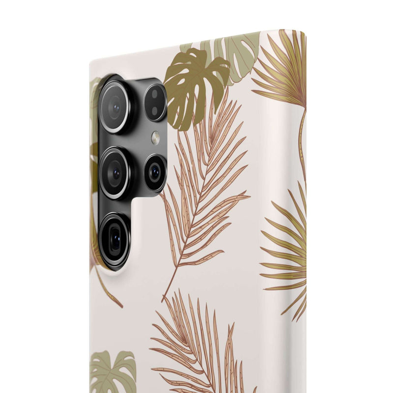 Nature-inspired mobile phone case with tropical leaf design, sleek and durable polycarbonate, compatible with iPhone 16 series, supports wireless charging.