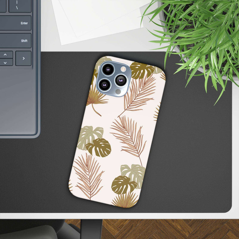 Nature-inspired mobile phone case with tropical leaf design, durable polycarbonate material, supports wireless charging.