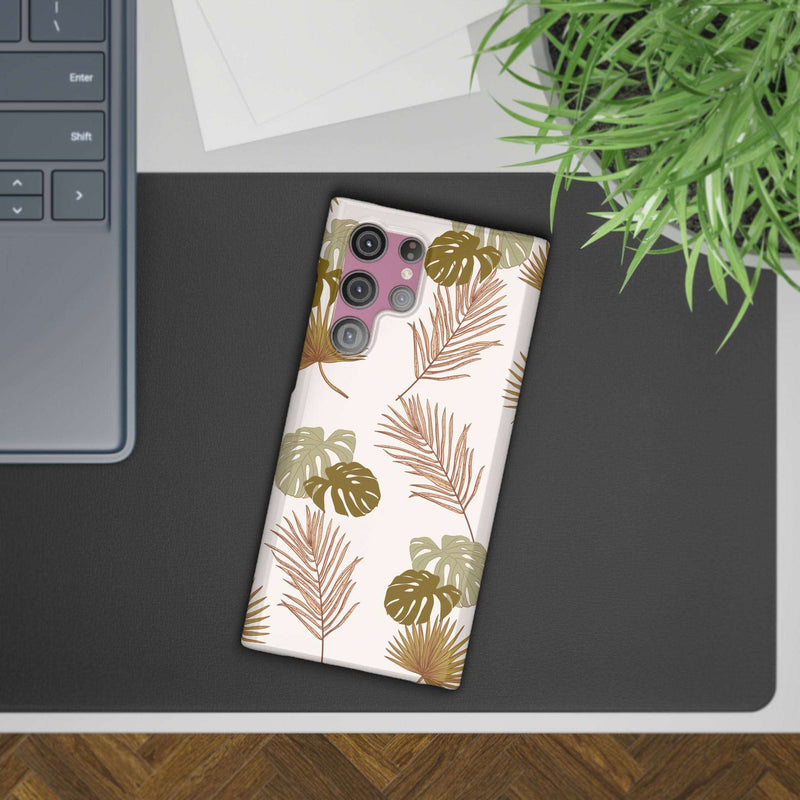 Nature-Inspired Mobile Phone Case with tropical leaf design on a desk.