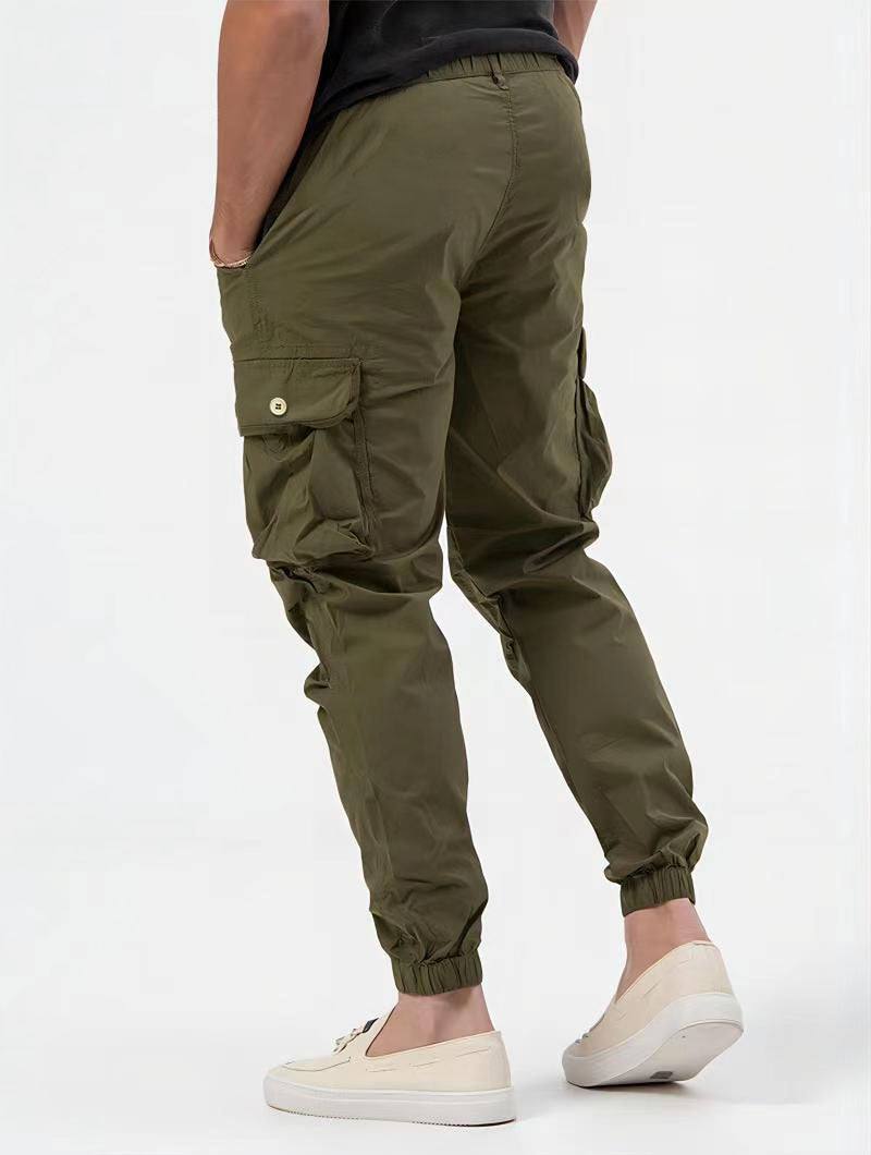 Men's stylish cargo trousers with innovative 3D pockets in solid color.