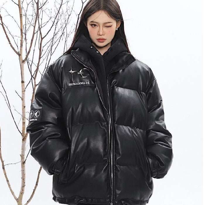 Women's insulated puffer jacket in black, offering warmth and style for winter.