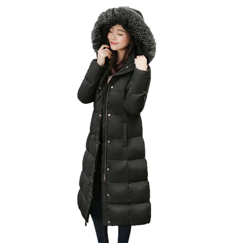 Elegant black long down coat for women with faux fur hood, warm and lightweight winter jacket.