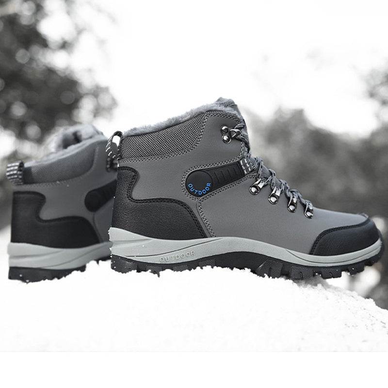 Winter boots for men with plush lining and hiking lace-up design on snowy terrain.