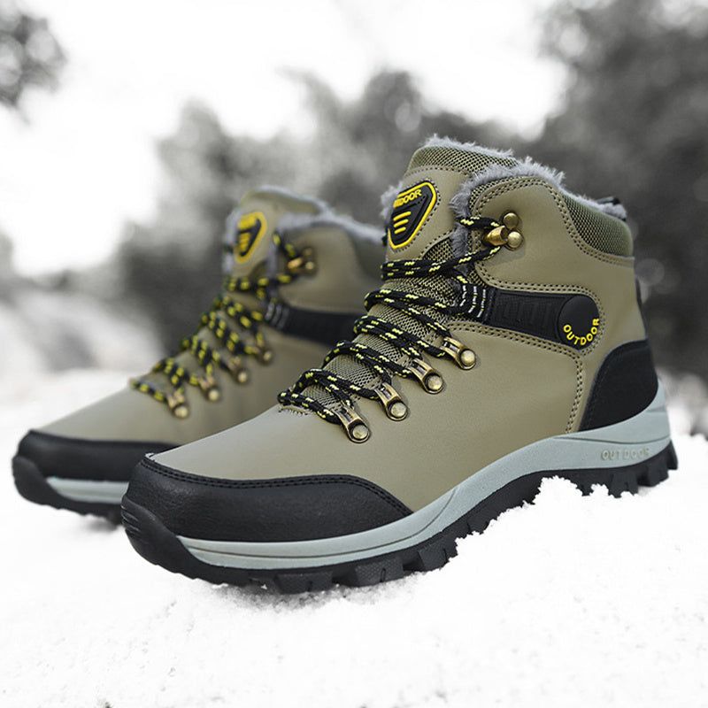 Winter boots for men with warm plush lining and hiking lace-up design on snowy terrain.