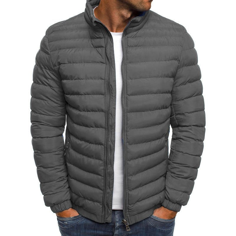 Men's cold-weather insulated jacket in gray, stylish padded coat with zipper closure and secure pockets for winter warmth.