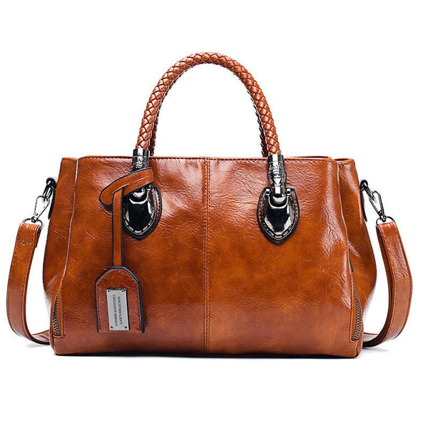 Timeless luxury vintage leather handbag with oil wax design, exquisite craftsmanship, classic silhouette, and multiple compartments.