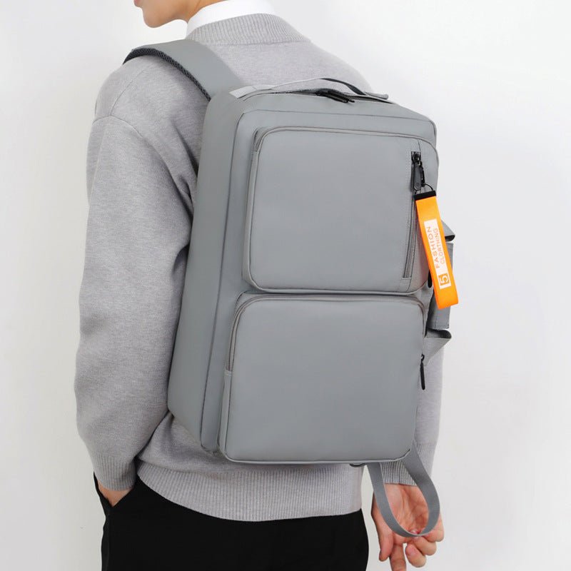 Gray Vantage Style Business Laptop Bag worn on a person's back, showcasing large capacity and sleek design.