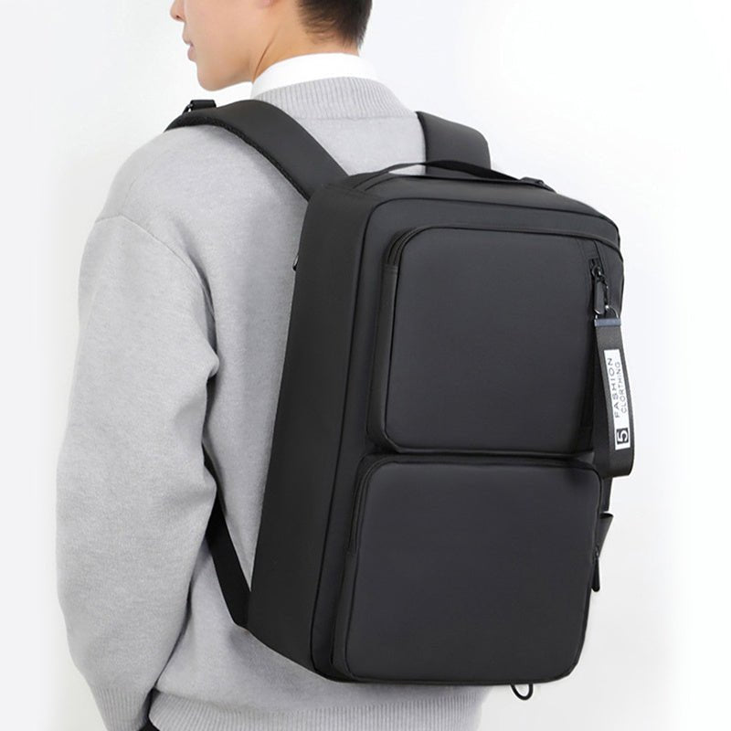 Black Vantage Style Business Laptop Bag worn by a person, showcasing its large capacity and sleek design.