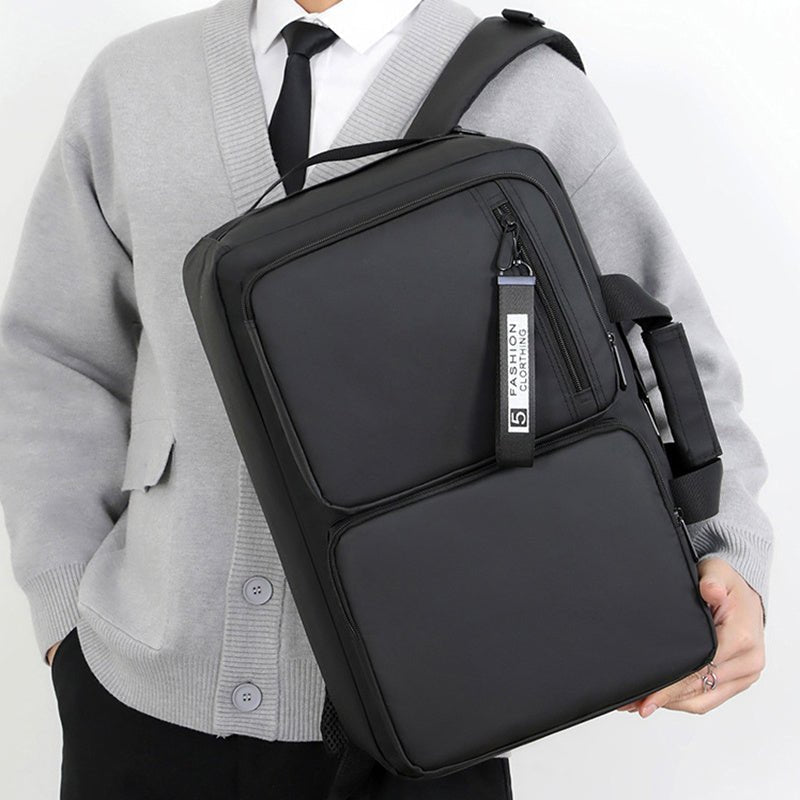 Black business laptop bag with large capacity, ergonomic shoulder strap, and sleek design, suitable for work, school, and travel.